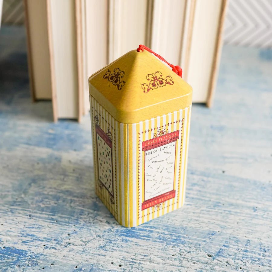 Jelly Bean Tin with yellow and white stripes, multicoloured dots, and a list of jelly bean flavours inside a red frame.