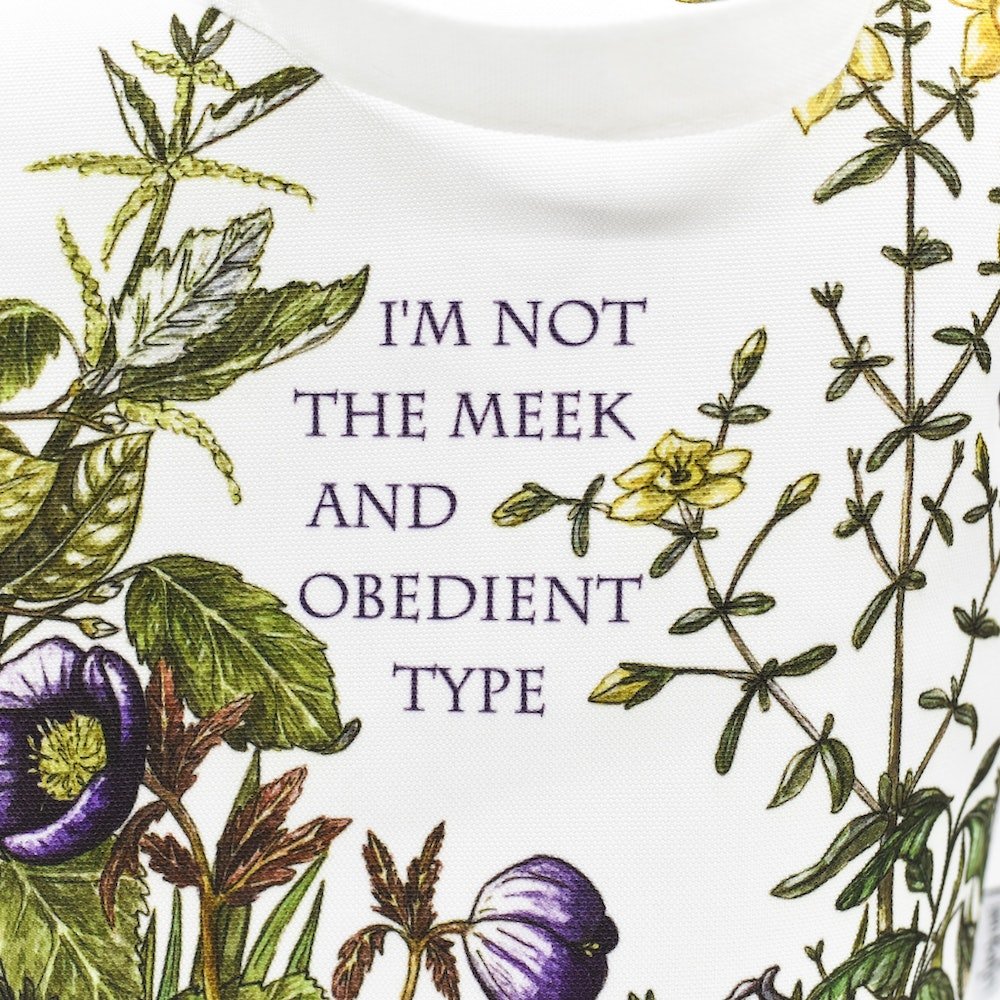 White natural canvas bag with standup bottom with the quote &quot;I&#39;m Not The Meek And Obedient Type&quot;