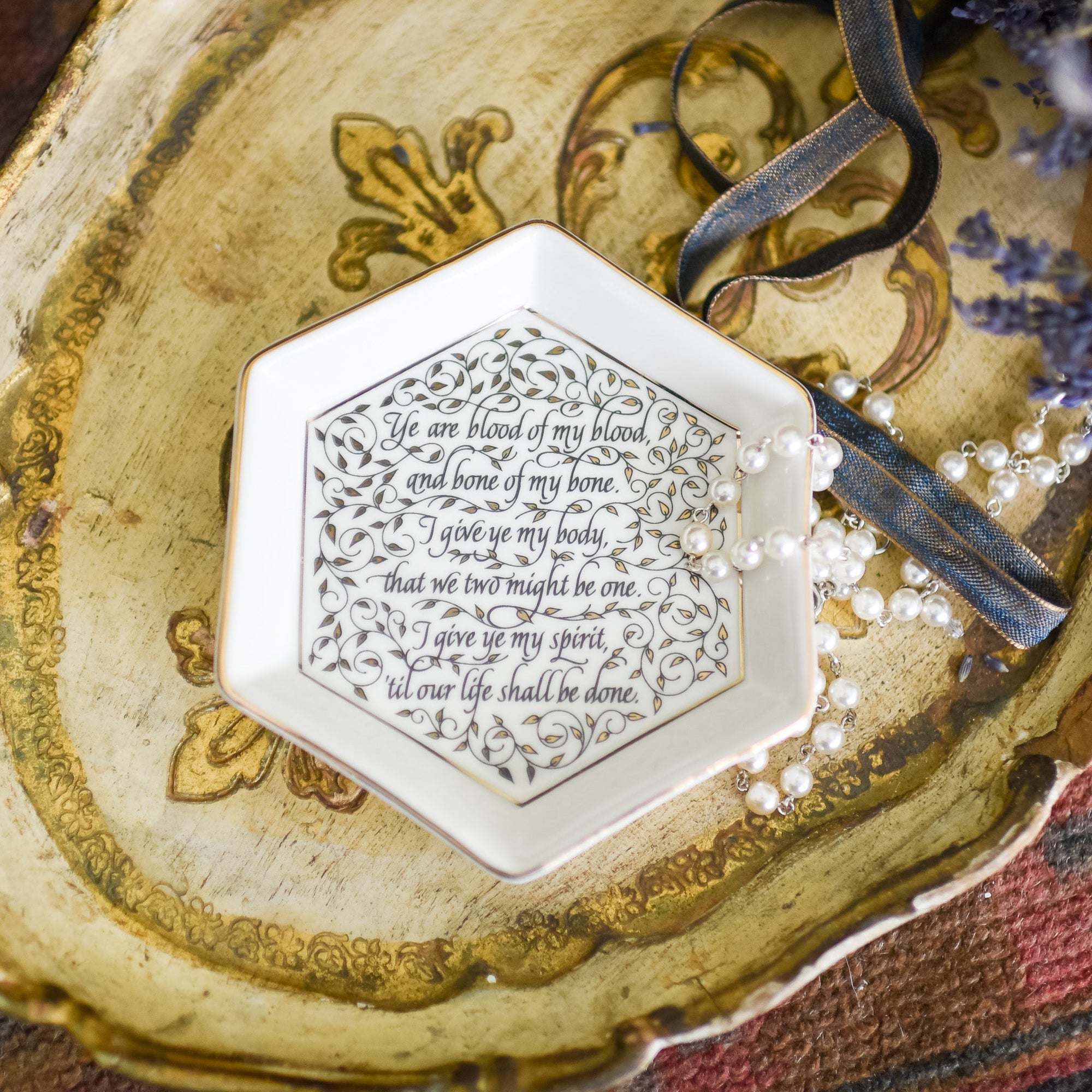 Sassenach Wedding Vows Trinket Dish is white with gold edges and leaves and the wedding vows between our favorite Sassenach and her highlander husband