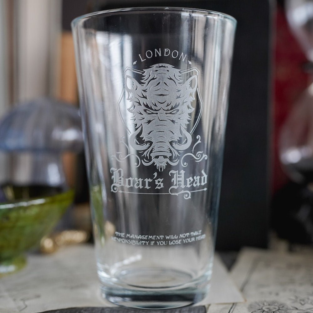 Shakespeare Boar&#39;s Head Pub Glass is a tall and clear cup with an etched boar&#39;s head and the words &quot;London&quot; and &quot;Boar&#39;s Head&quot;