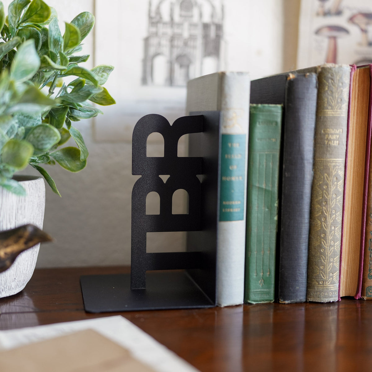 Black TBR bookends with &quot;TBR&quot; in block letters sitting on their sides