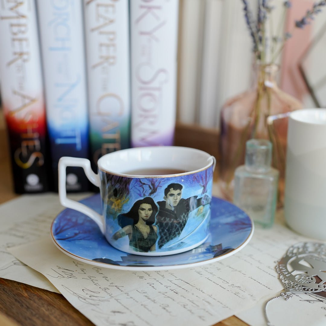 The Waiting Place Teacup and Saucer set has artwork of Laia and Elias from An Ember in the Ashes